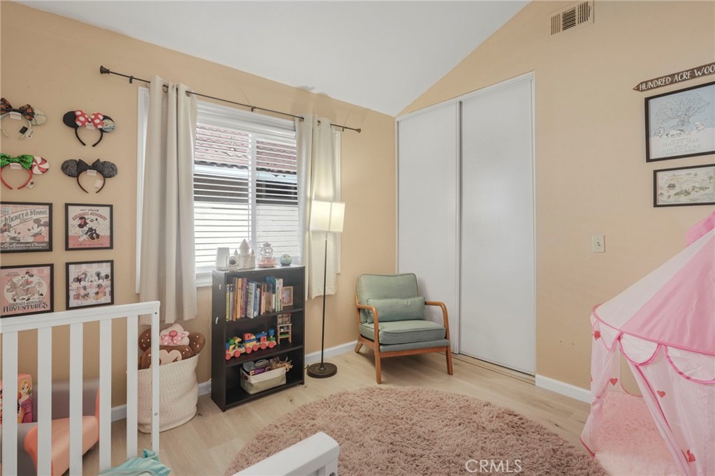 3670 Windstorm Way Riverside, CA 92503 - Photo 18 of 43 a living room with furniture and a floor to ceiling window