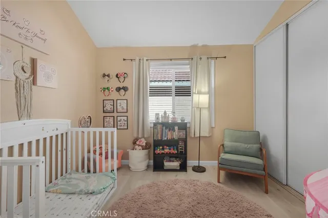a bedroom with furniture and a window