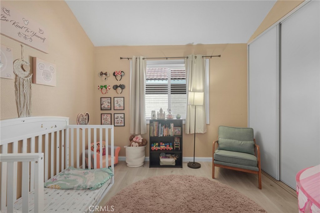 3670 Windstorm Way Riverside, CA 92503 - Photo 19 of 43 a bedroom with furniture and a window