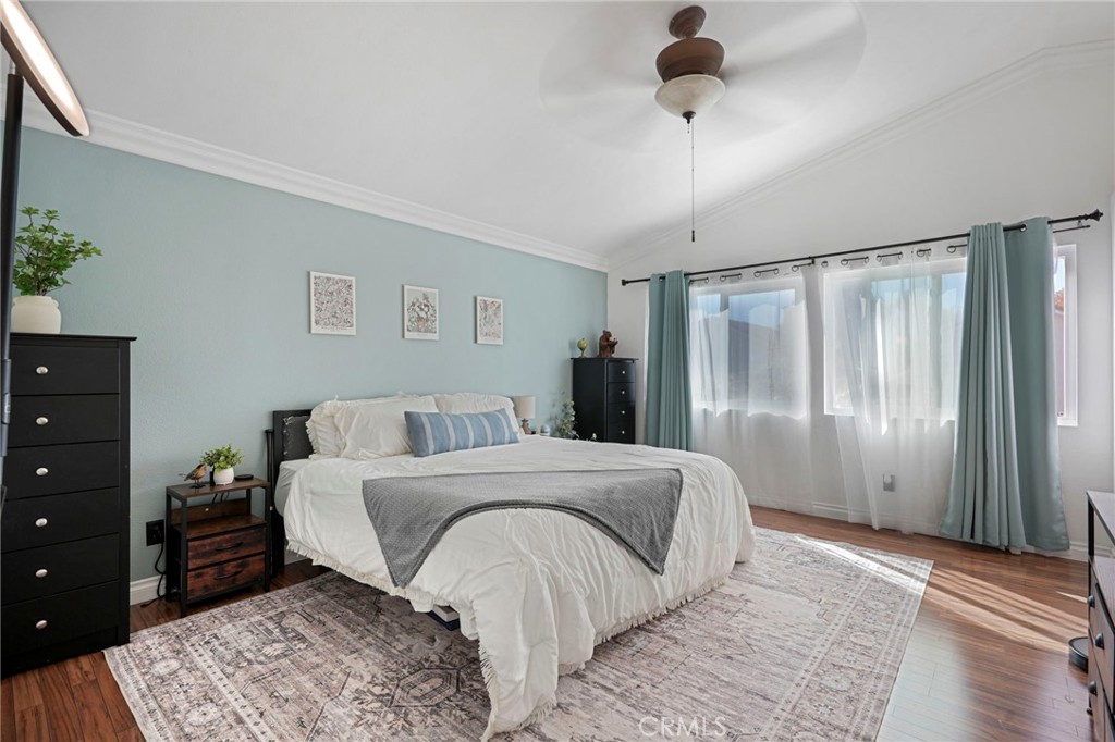 3670 Windstorm Way Riverside, CA 92503 - Photo 21 of 43 a bedroom with a bed and a dresser