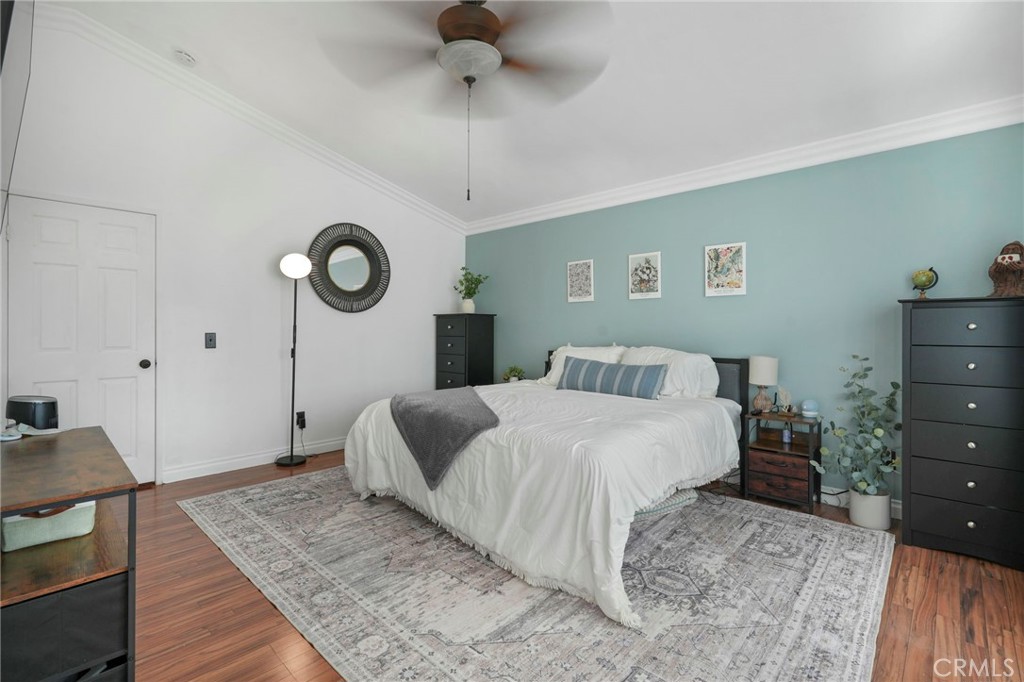 3670 Windstorm Way Riverside, CA 92503 - Photo 22 of 43 a bedroom with a bed and a dresser