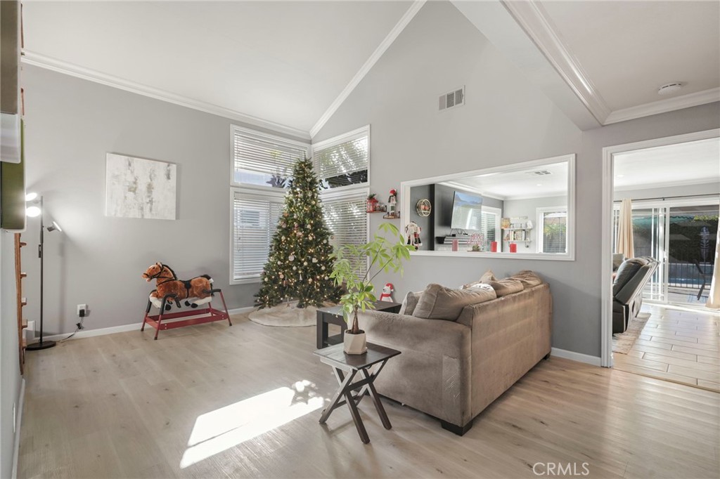 3670 Windstorm Way Riverside, CA 92503 - Photo 5 of 43 a living room with furniture and a chandelier