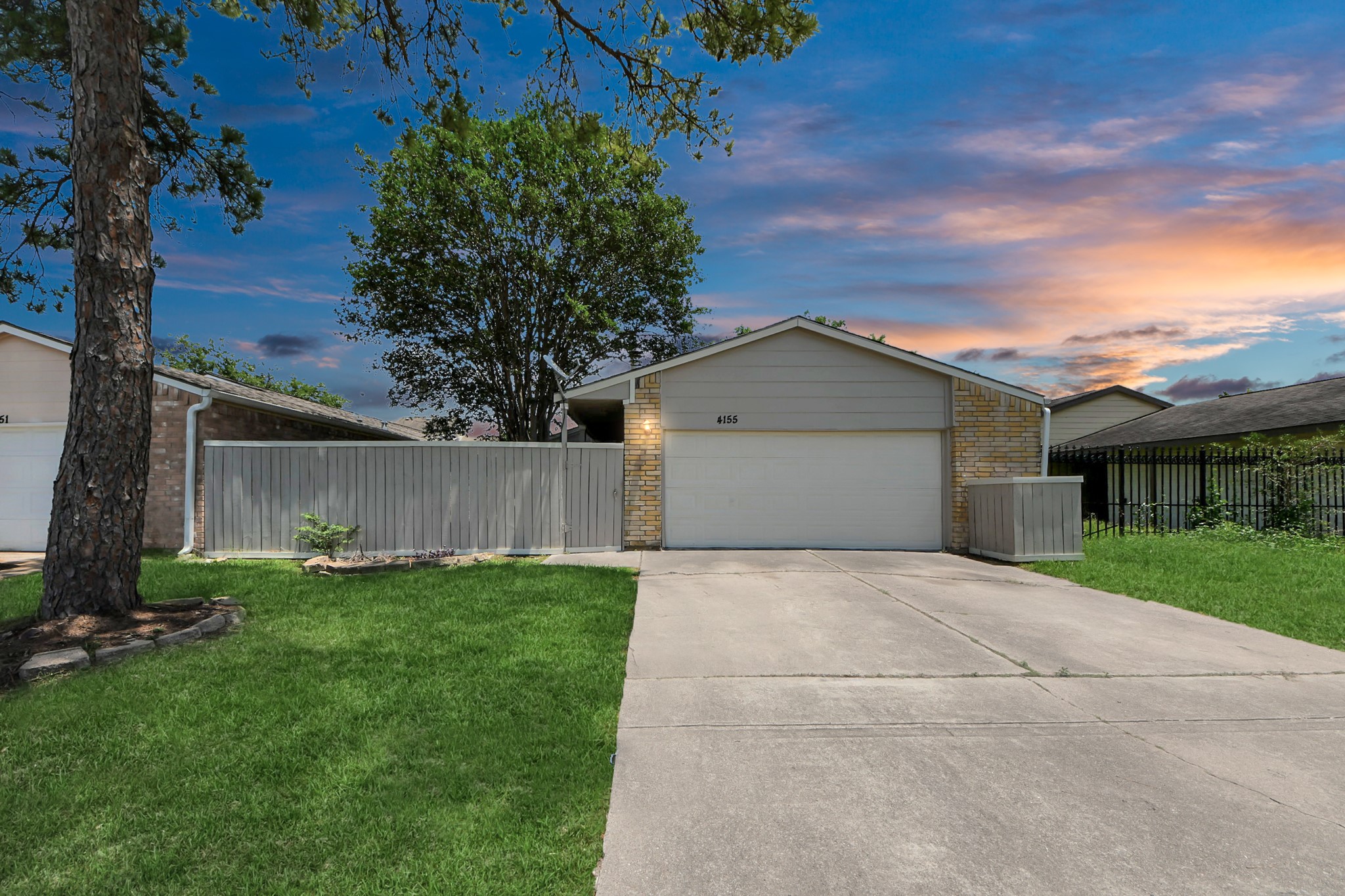 4155 Amir Street Houston, TX 77072 - Photo 1 of 43 a front view of a house with a yard and garage