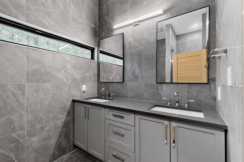 8839 Southern Shore Kemp, TX 75143 - Photo 17 of 40 a bathroom with a double vanity sink and mirror