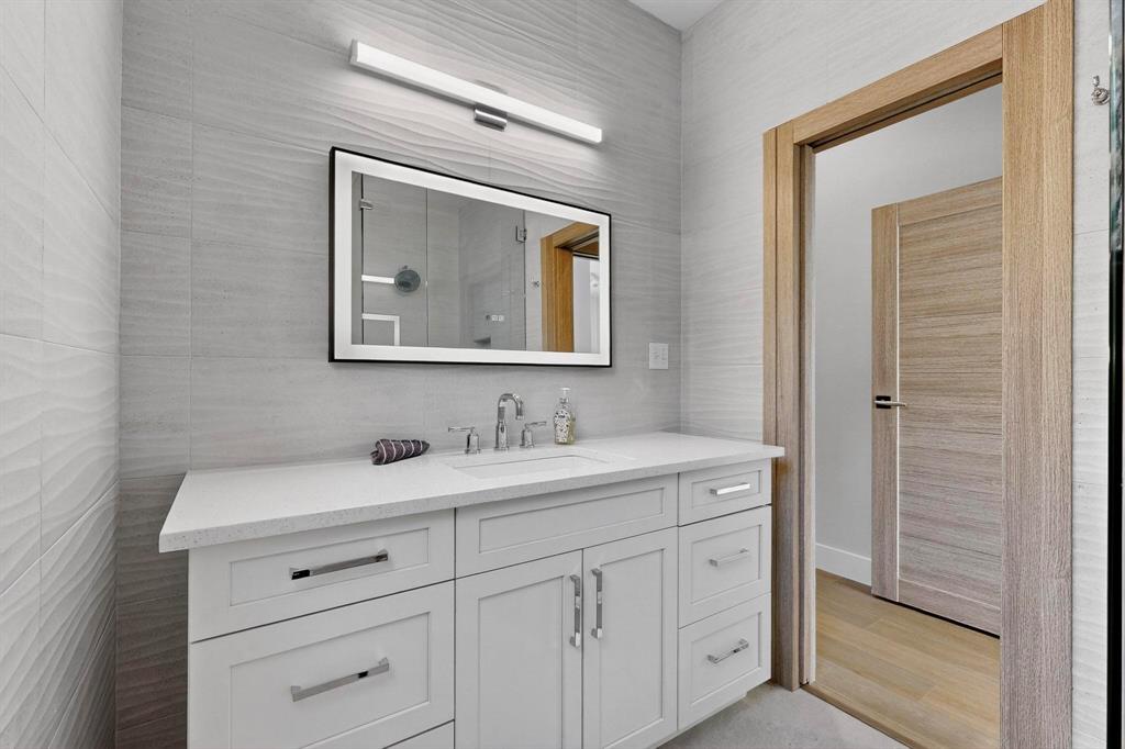 8839 Southern Shore Kemp, TX 75143 - Photo 19 of 40 a bathroom with a toilet sink and mirror