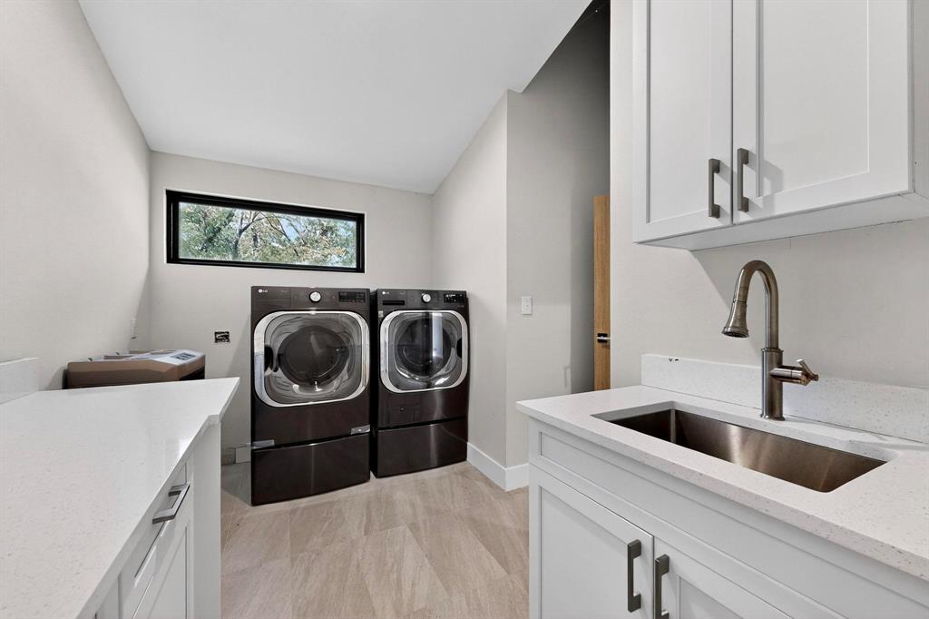8839 Southern Shore Kemp, TX 75143 - Photo 22 of 40 a utility room with sink dryer and washer