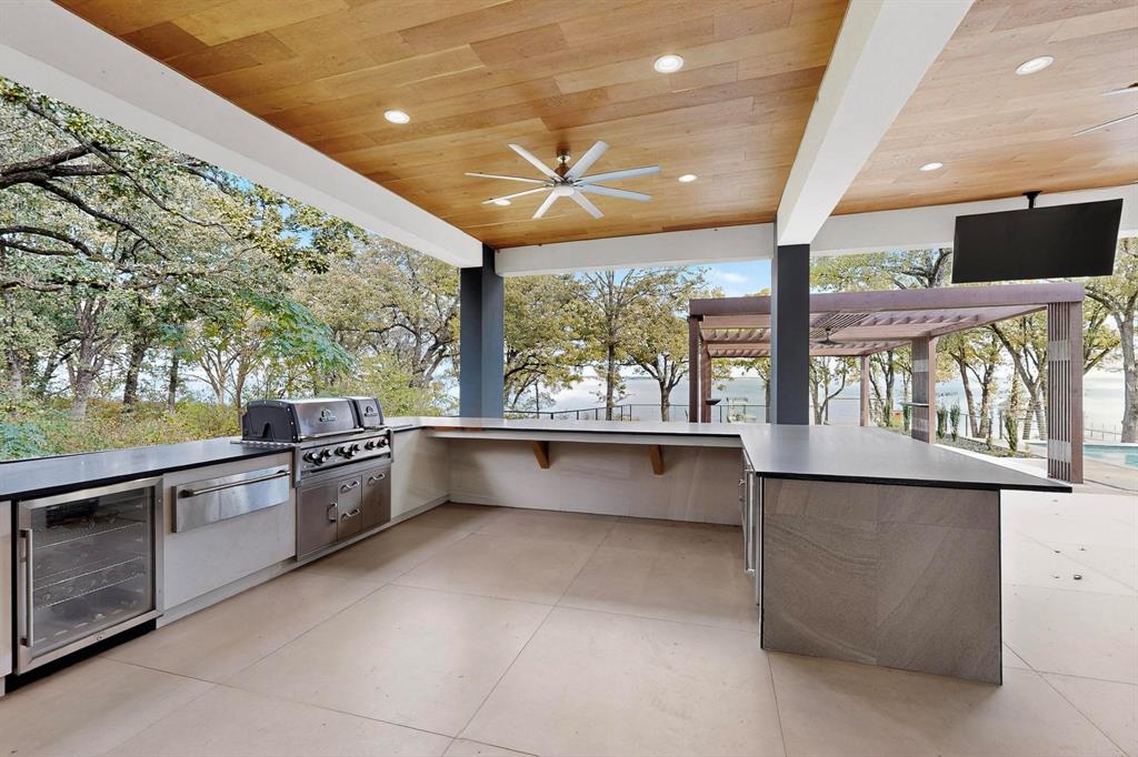 8839 Southern Shore Kemp, TX 75143 - Photo 29 of 40 a large kitchen with stainless steel appliances a large counter top