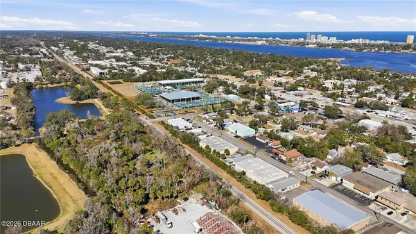 an aerial view of residential building and ocean view