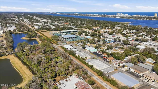 an aerial view of residential building and ocean view