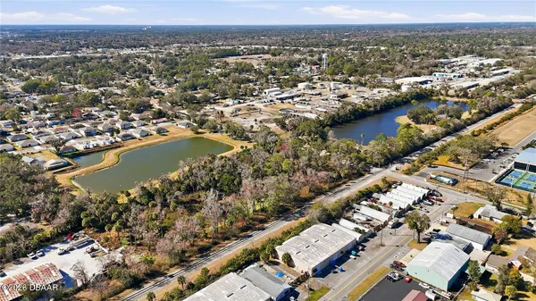 an aerial view of residential building and lake