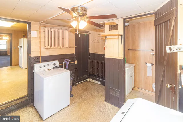 a bathroom with a sink a mirror and a shower