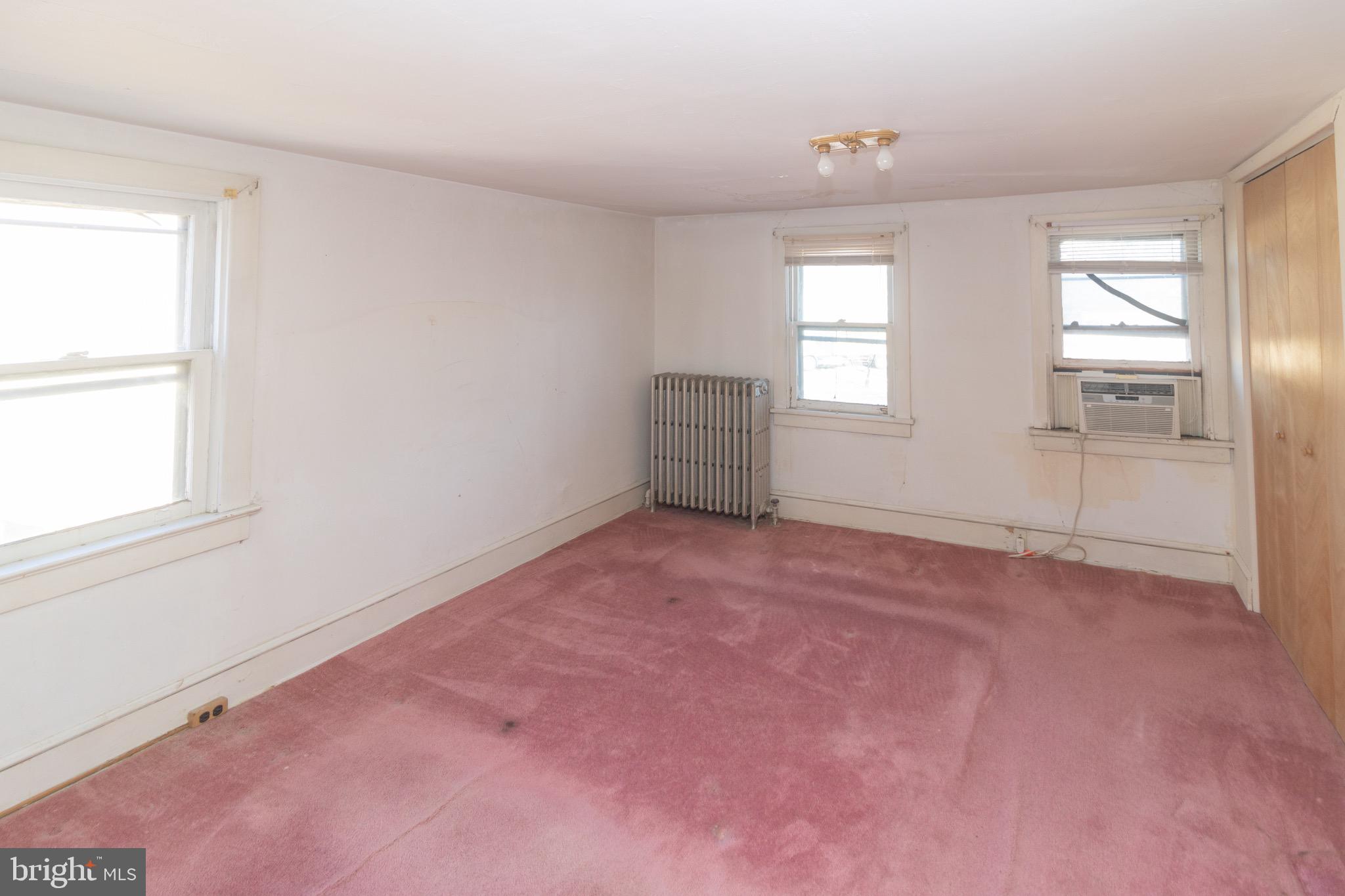 178 Mill Street Mount Holly, NJ 08060 - Photo 14 of 35 an empty room with windows and closet