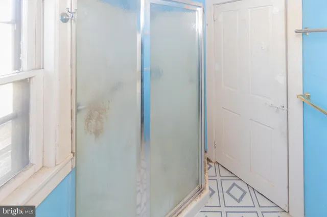 a view of a big room with windows