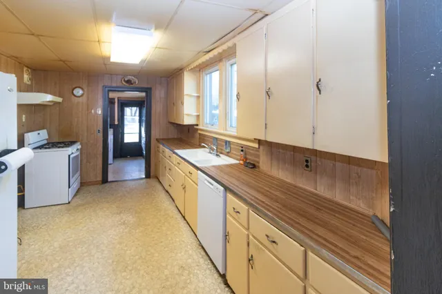 a spacious bathroom with a double vanity sink and a mirror