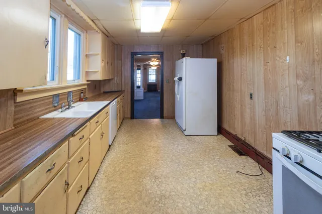 a spacious bathroom with a double vanity sink and a mirror