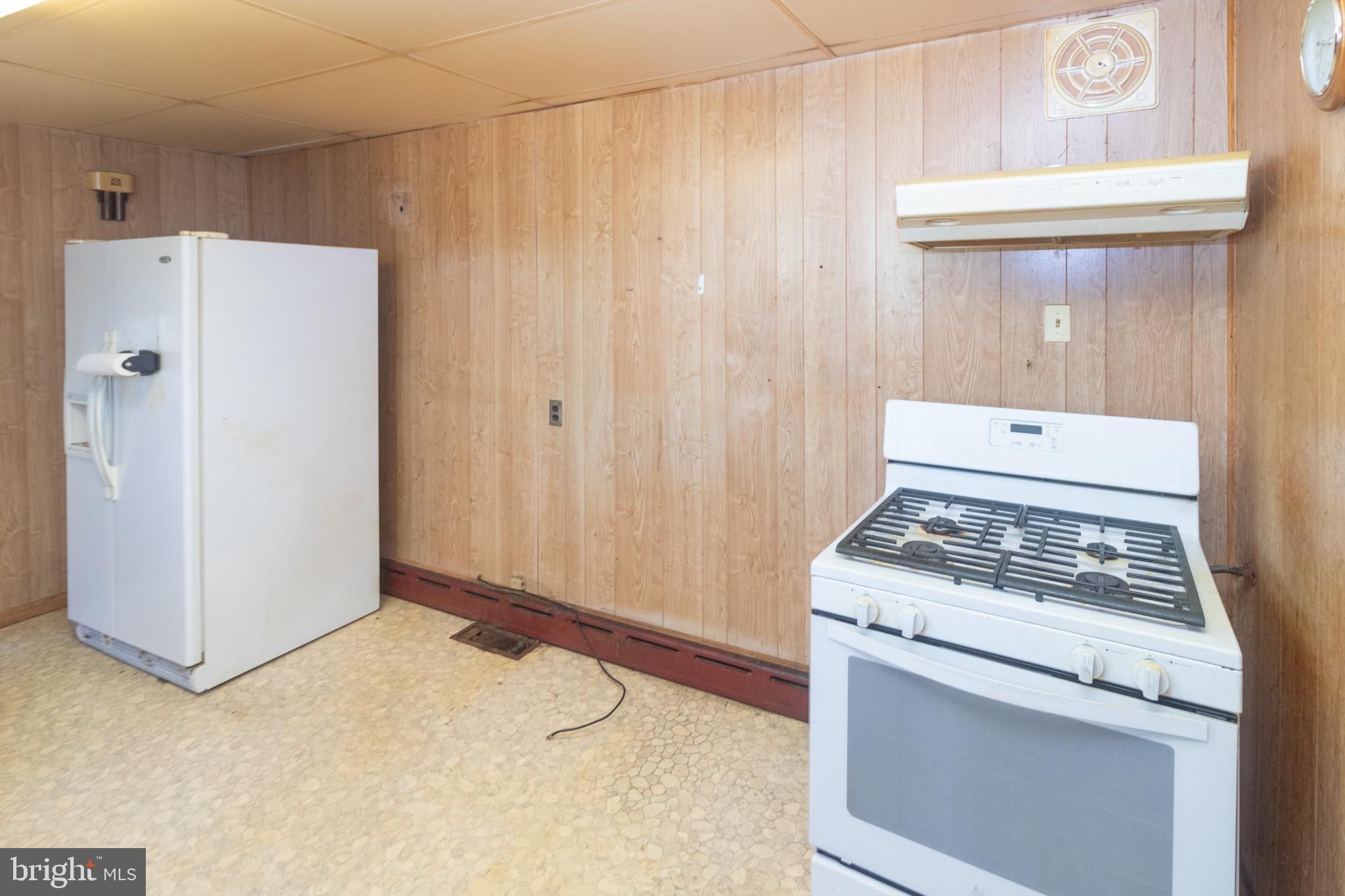 178 Mill Street Mount Holly, NJ 08060 - Photo 10 of 35 a kitchen with a stove and a refrigerator