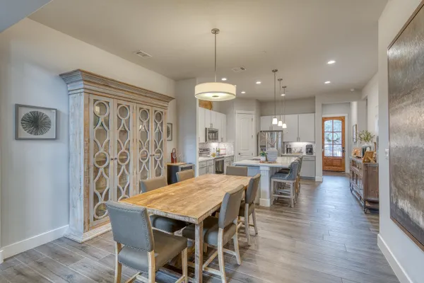 a view of a dining area with furniture window and wooden floor
