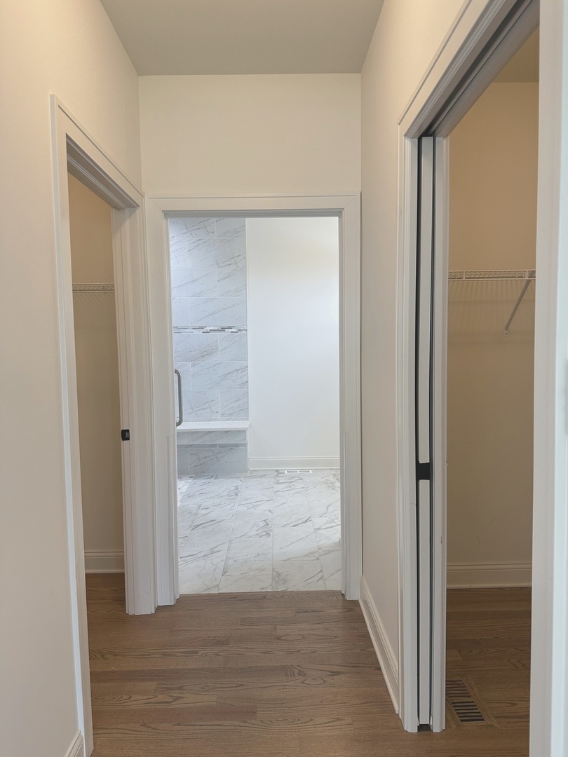 9014 Gloucester Road Woodridge, IL 60517 - Photo 17 of 30 an empty room with wooden floor and door