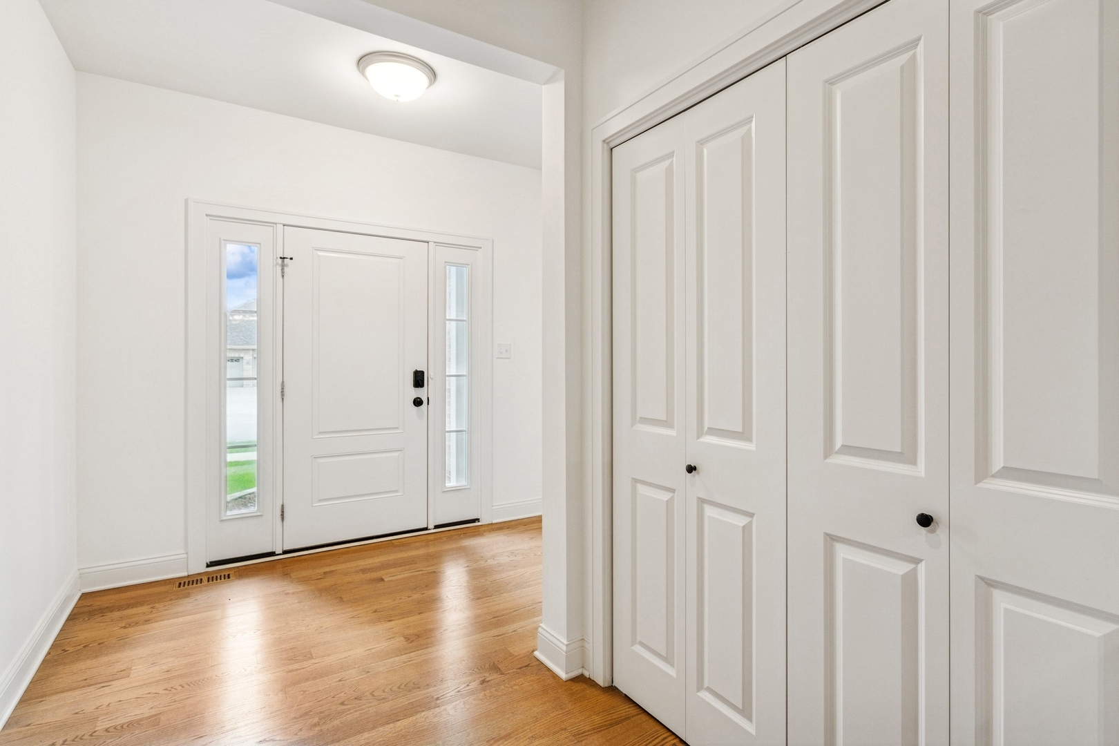 9014 Gloucester Road Woodridge, IL 60517 - Photo 3 of 30 a view of a hallway with wooden floor