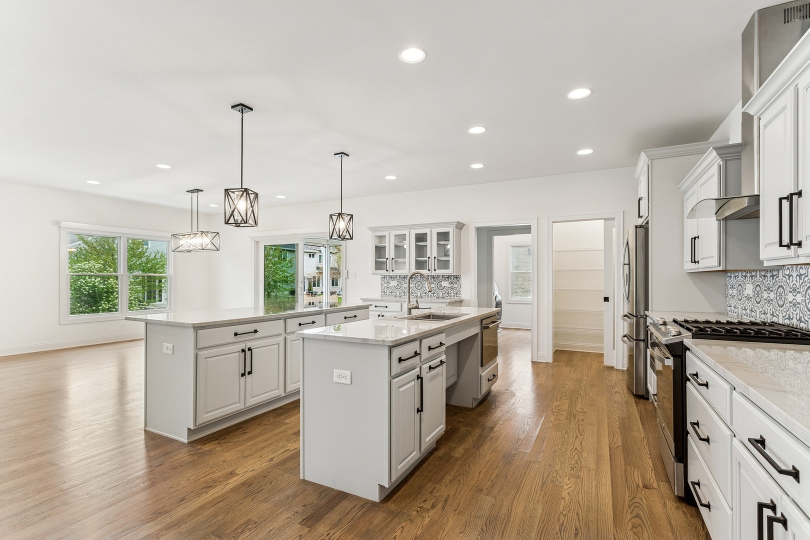 9014 Gloucester Road Woodridge, IL 60517 - Photo 7 of 30 a kitchen with stainless steel appliances granite countertop a stove and cabinets