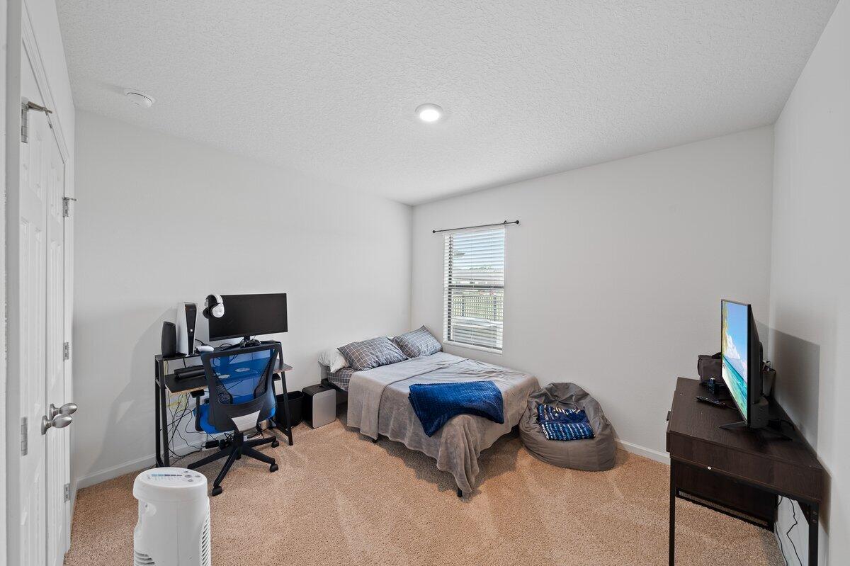 1652 Saxton Road Cocoa, FL 32926 - Photo 12 of 30 a view of a workspace with furniture and a window