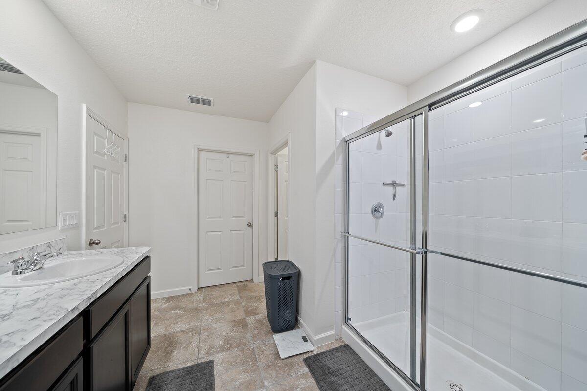 1652 Saxton Road Cocoa, FL 32926 - Photo 17 of 30 a bathroom with a granite countertop sink and a mirror