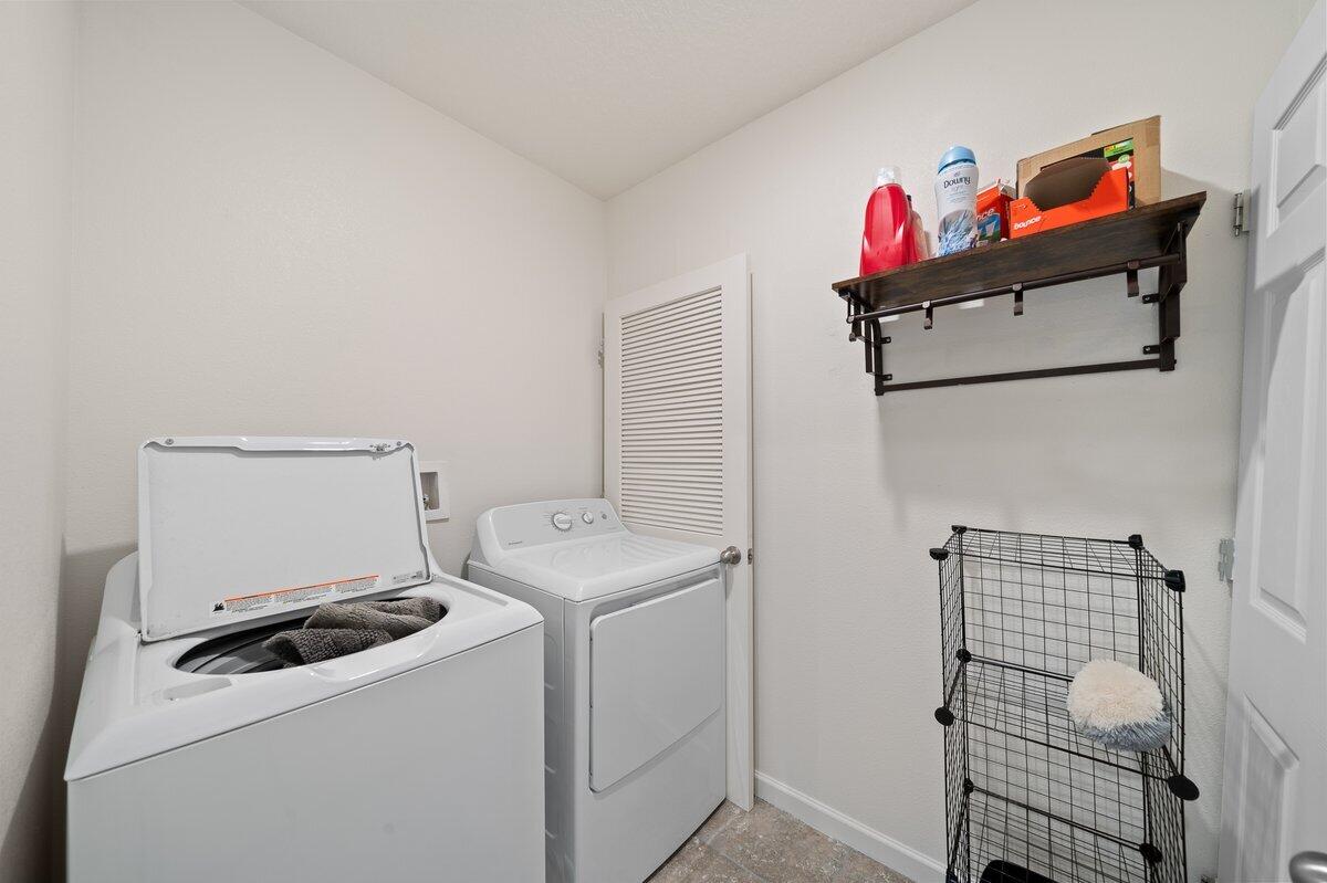 1652 Saxton Road Cocoa, FL 32926 - Photo 18 of 30 a utility room with dryer and washer