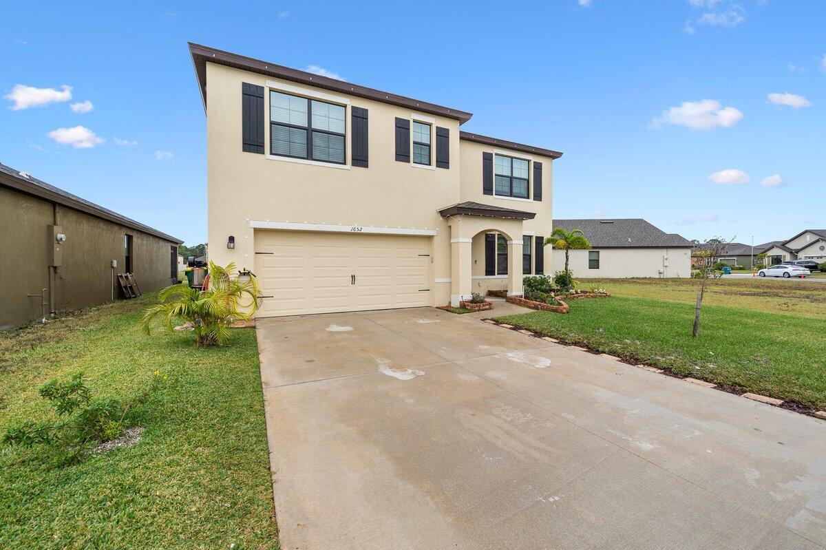 1652 Saxton Road Cocoa, FL 32926 - Photo 2 of 30 a house view with a garden space