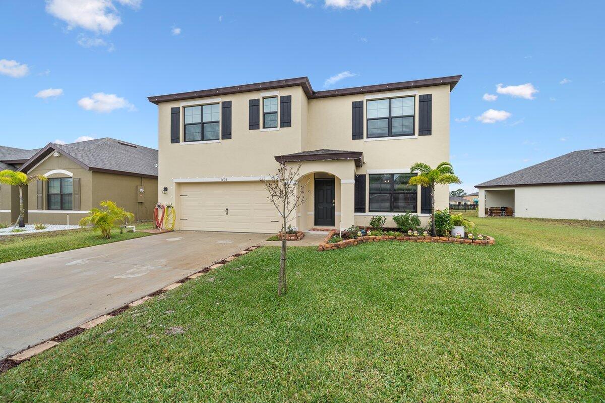 1652 Saxton Road Cocoa, FL 32926 - Photo 3 of 30 a house view with a garden space
