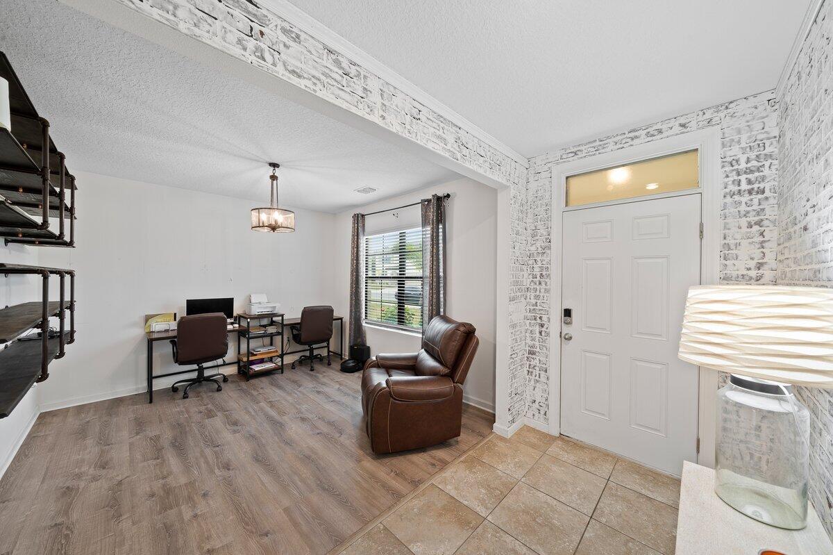 1652 Saxton Road Cocoa, FL 32926 - Photo 5 of 30 a living room with furniture and a window
