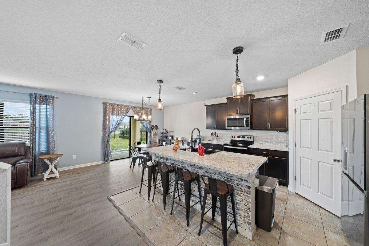 1652 Saxton Road Cocoa, FL 32926 - Photo 6 of 30 a view of a dining room with furniture window and wooden floor