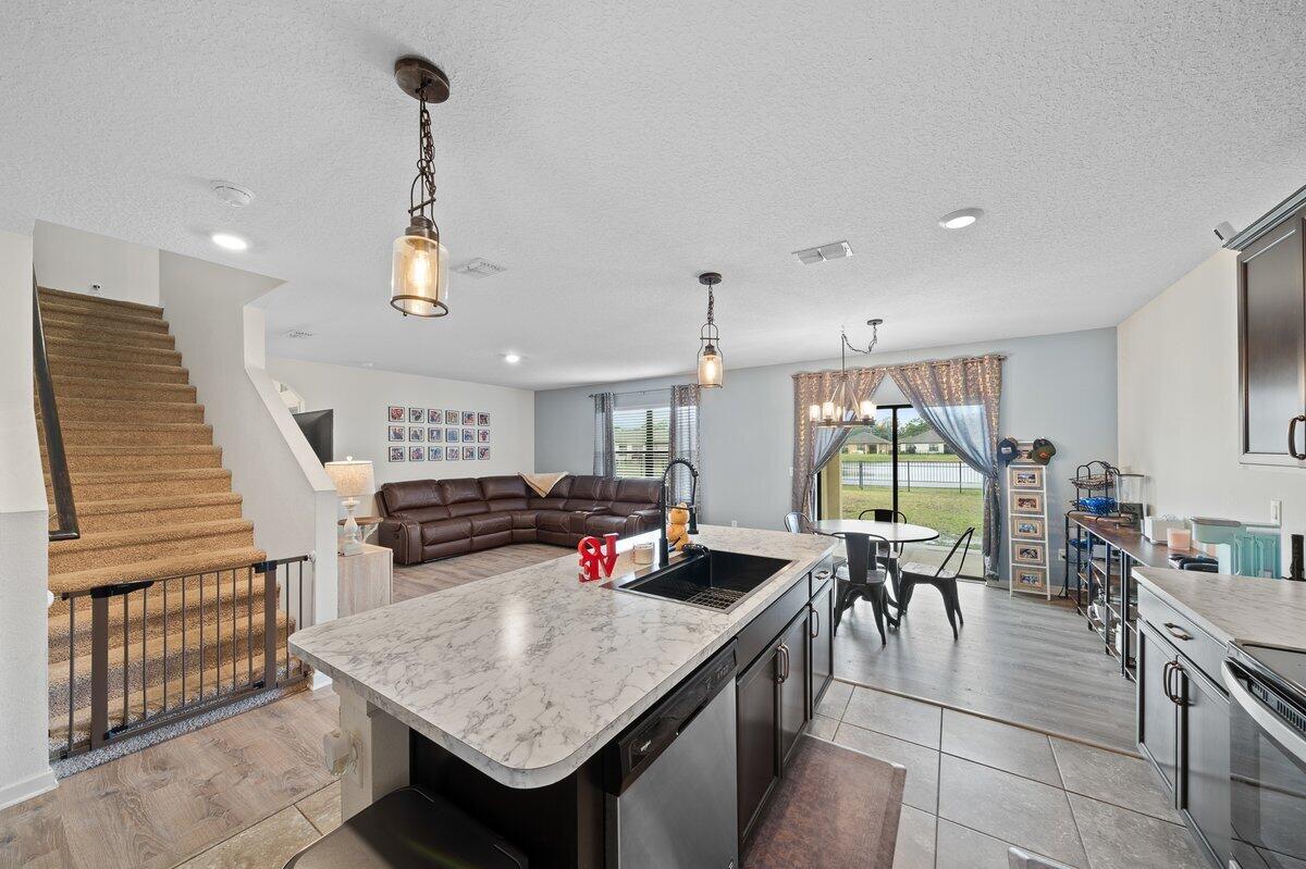 1652 Saxton Road Cocoa, FL 32926 - Photo 9 of 30 a living room with furniture a table and chairs