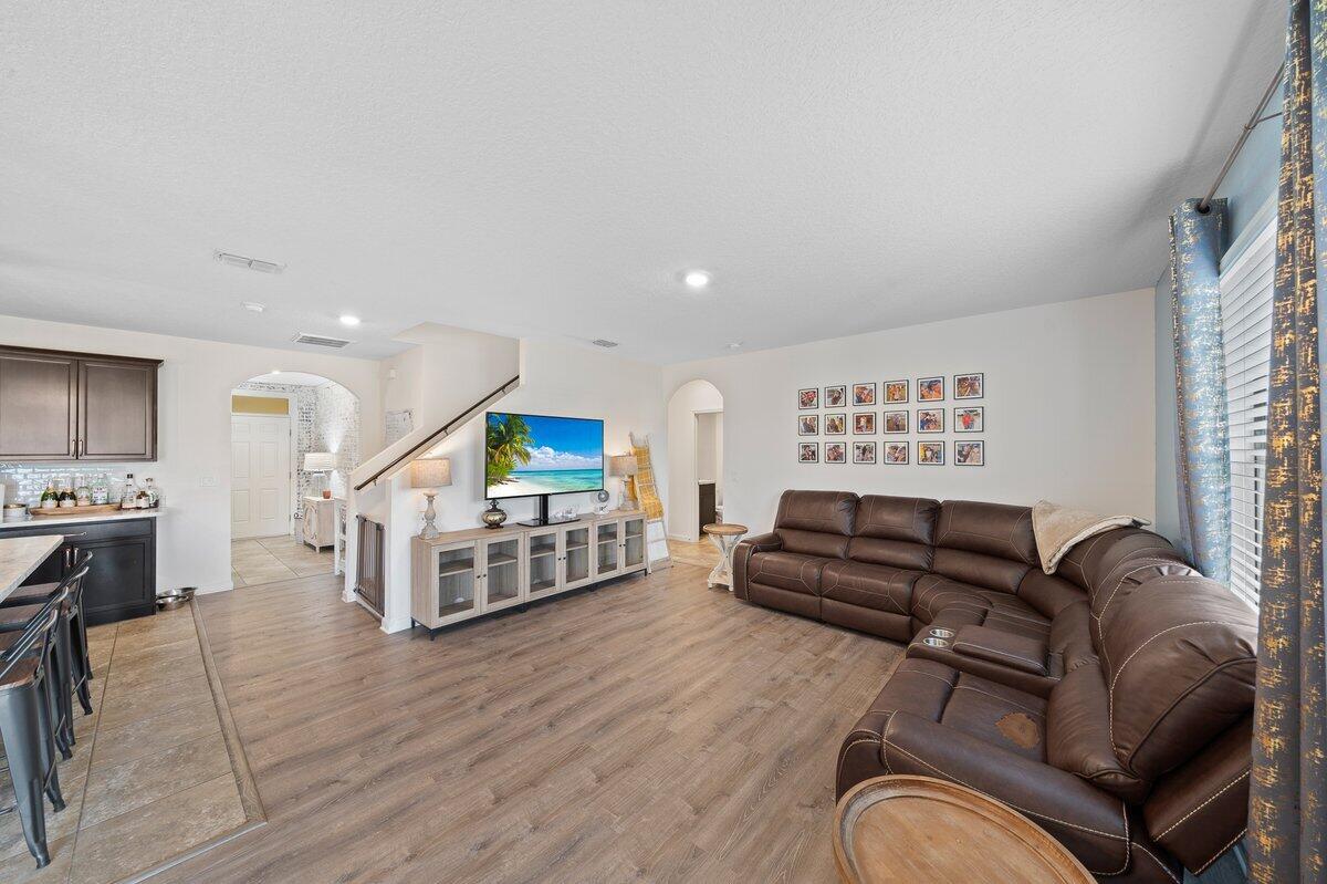 1652 Saxton Road Cocoa, FL 32926 - Photo 10 of 30 a living room with furniture and a flat screen tv