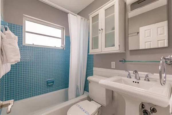 a bathroom with a sink and a bathtub