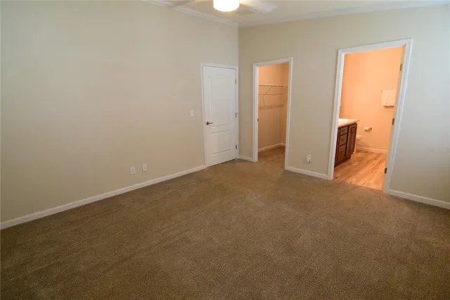 an empty room with closet area