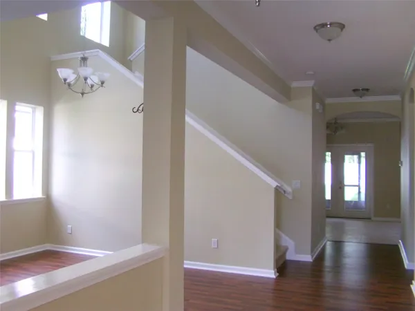 a view of livingroom with hallway and wooden floor