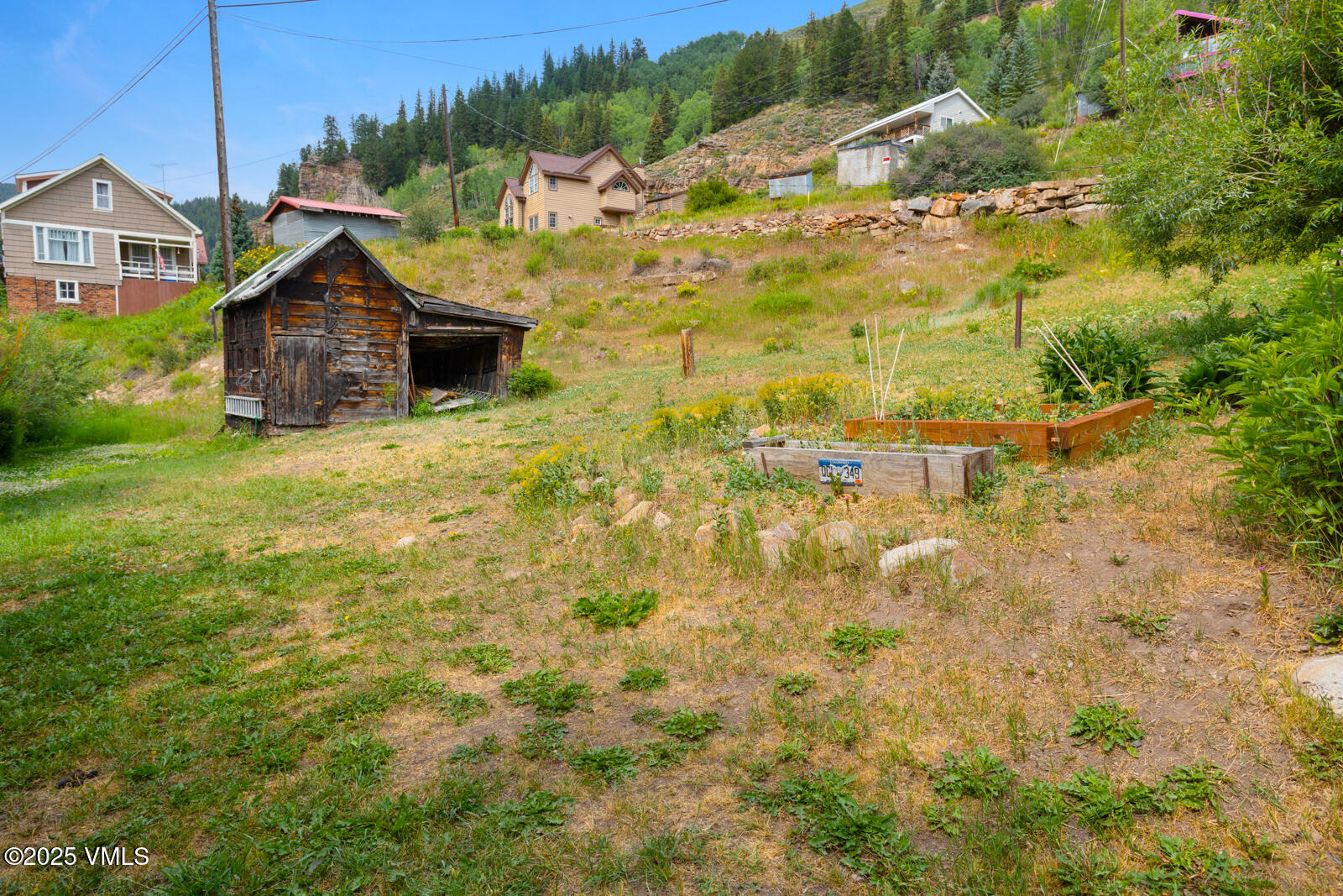 407 Water Street Red Cliff, CO 81649 - Photo 10 of 25 a view of a house with a wooden fence