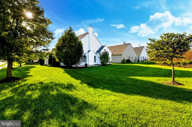 a view of a house with a big yard