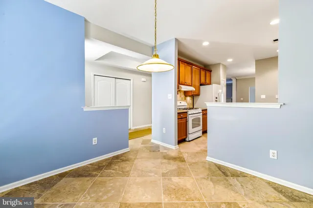 a view of a kitchen with a sink and cabinets