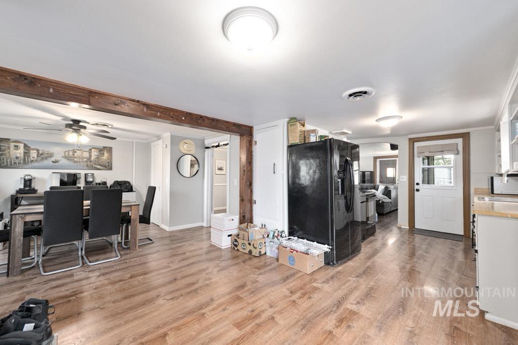 259 Highway 12 Pomeroy, WA 99347 - Photo 6 of 45 Open-concept living area featuring wood-finish flooring, exposed wood beam accents, and recessed ceiling lighting