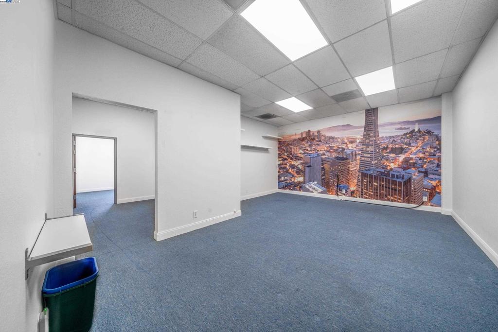 212 9th Street, Unit 208 Oakland, CA 94607 - Photo 2 of 13 a view of a hallway with workspace
