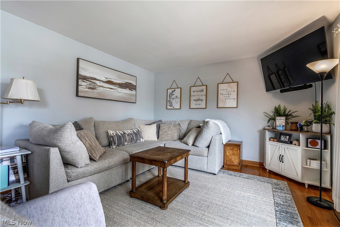 6775 Grove Road Clinton, OH 44216 - Photo 7 of 19 Living room featuring wood finished floors and baseboards