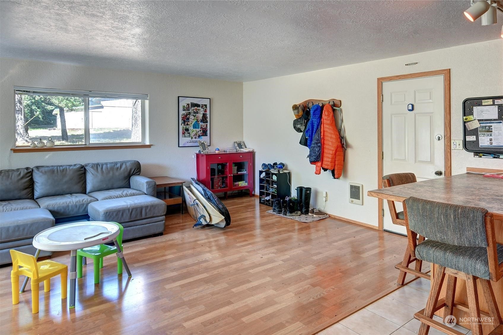 271 East Big Skookum Road Shelton, WA 98584 - Photo 14 of 24 a living room with furniture a wooden floor and a large window
