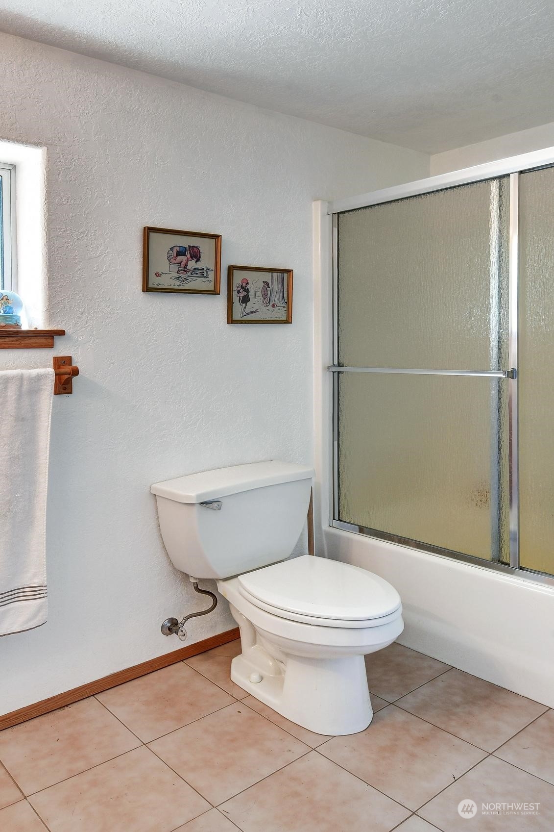 271 East Big Skookum Road Shelton, WA 98584 - Photo 17 of 24 a white toilet sitting next to a bathroom sink