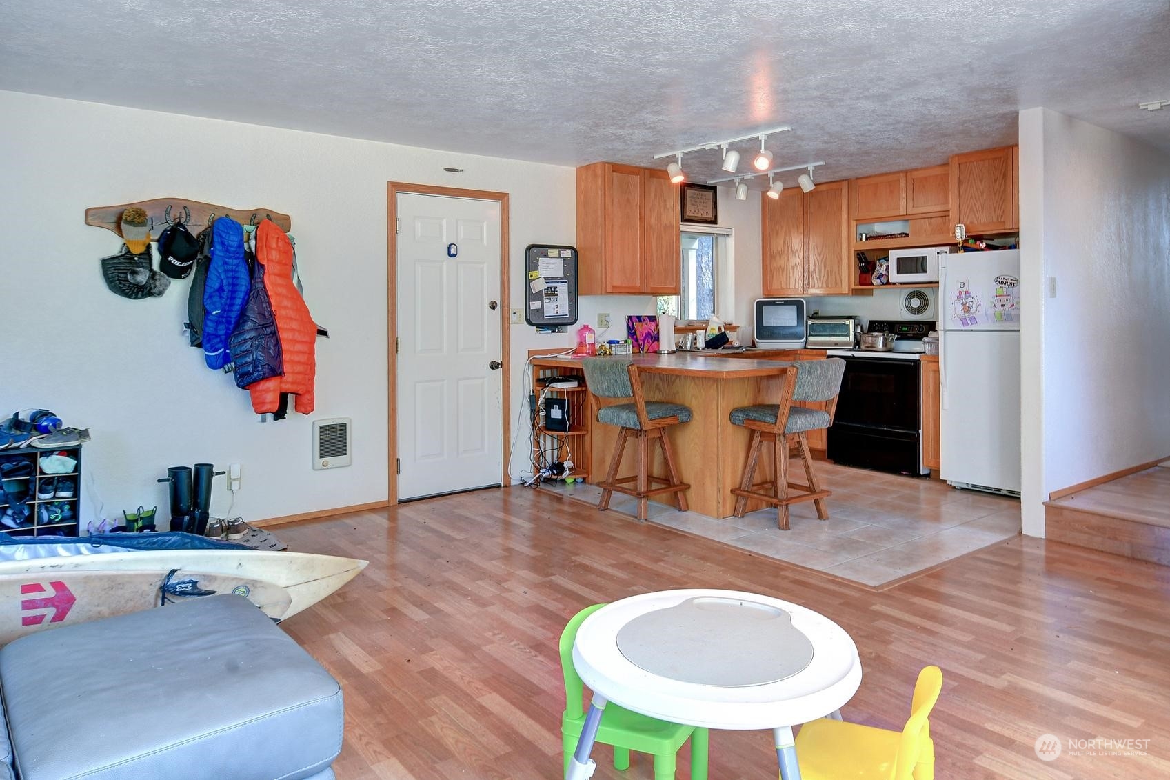 271 East Big Skookum Road Shelton, WA 98584 - Photo 18 of 24 a living room with furniture a rug and a dining table