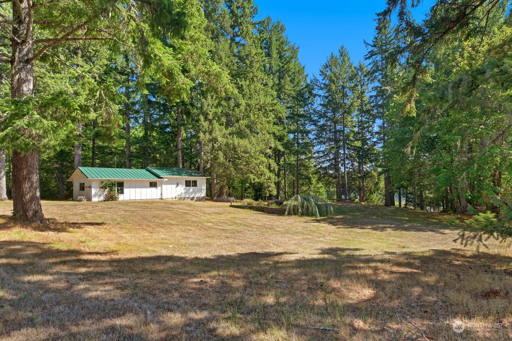 271 East Big Skookum Road Shelton, WA 98584 - Photo 3 of 24 a front view of a house with a yard