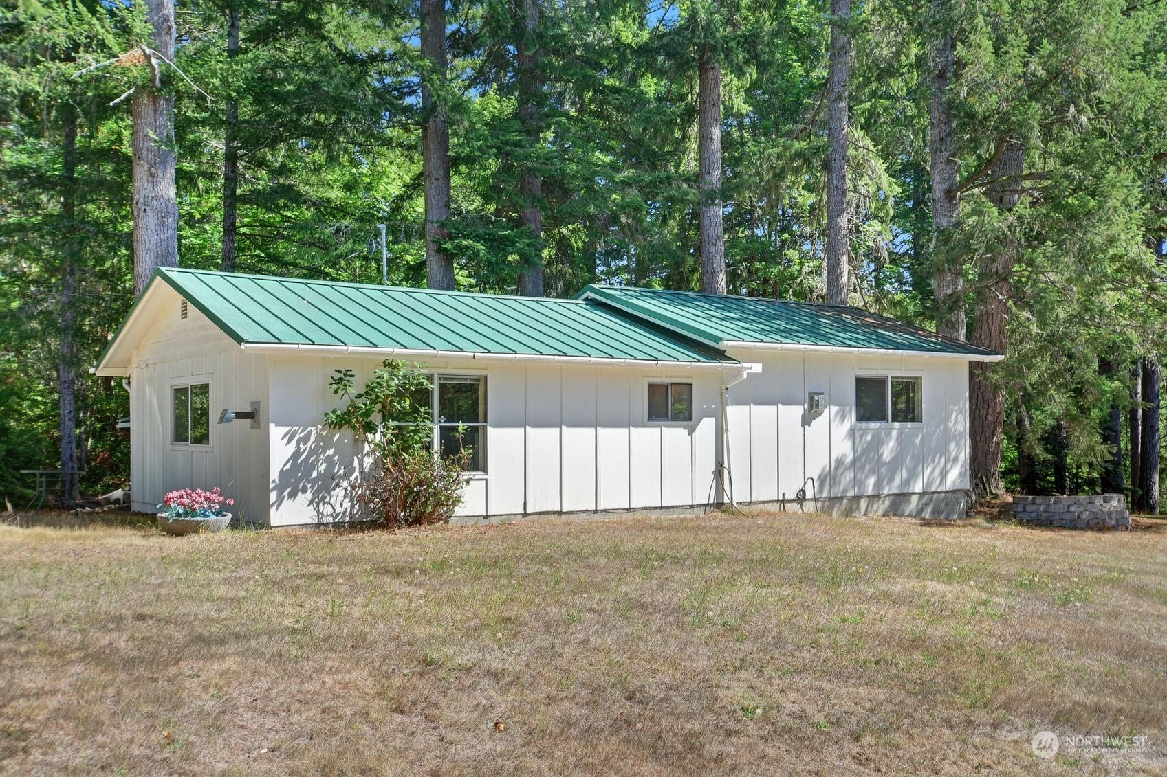 271 East Big Skookum Road Shelton, WA 98584 - Photo 6 of 24 front view of a house with a yard