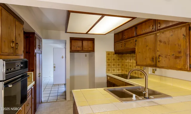 a view of livingroom with furniture cabinet and floor to ceiling window