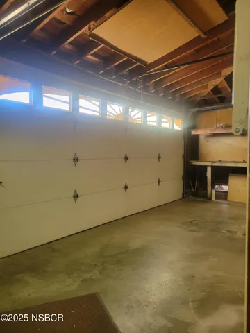 a view of a backyard with seating area