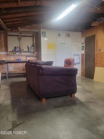 a view of a street with potted plants
